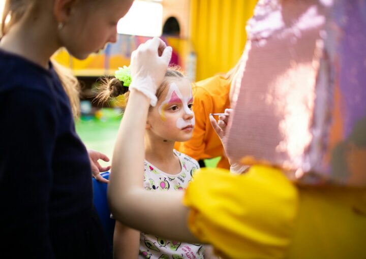 a group of young girls standing around each other